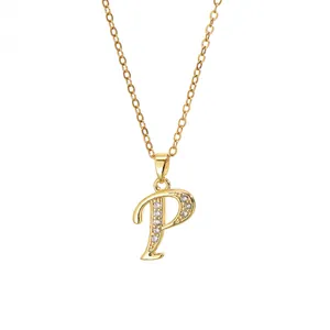 Detail of gold plated letter P pendant necklace with sparkling white cubic zirconia