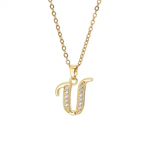 Close-up of gold-plated letter U pendant necklace set with sparkling zircon stones