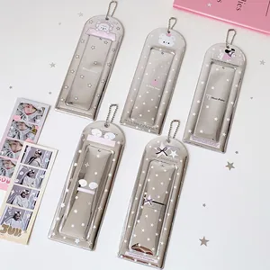 Detail of cartoon PVC mirror keychains featuring stars and puppy patterns with bead chains