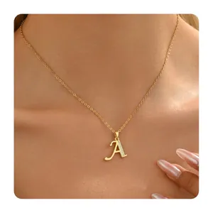 Gold brass necklace with letter A pendant and small clear zircons on a delicate chain