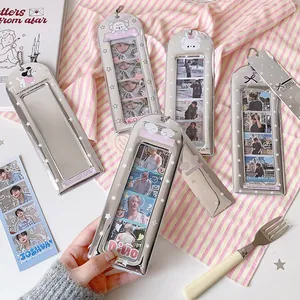 Detail of silver metallic photocard holder with four slots and hanging bead chain