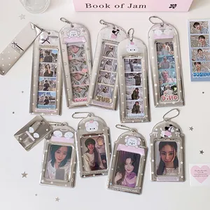 Metallic silver photocard holder with cute cartoon dogs and star charms for K-pop fans