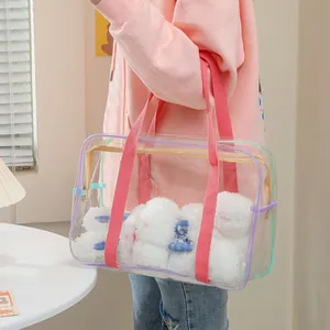 Transparent PVC tote bag with pink straps and purple piping featuring plush rabbit dolls