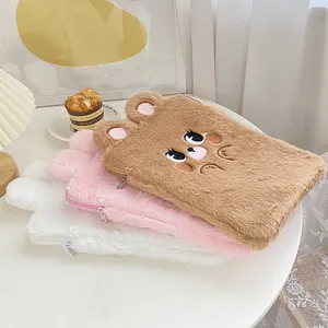 Detailed view of plush rabbit ear tablet cases in brown, pink and white with soft fur texture