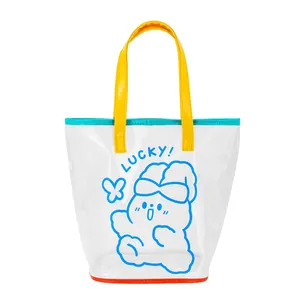 Close-up of transparent PVC tote bag featuring cartoon print and reinforced orange base