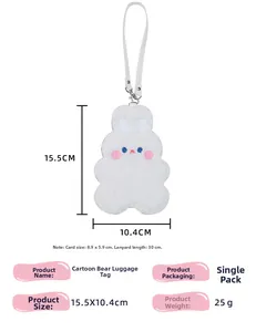 Detail of white plush bear card holder with embroidery and adjustable faux leather strap