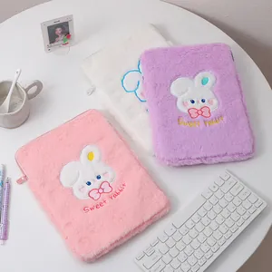 Detail of plush iPad sleeve featuring sweet rabbit embroidery and metal zipper closure