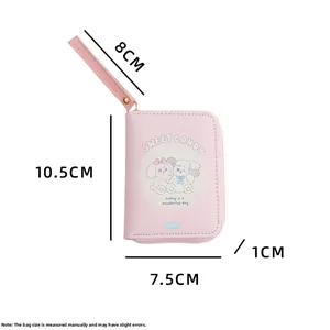 Detailed view of pink cartoon coin purse with size measurements and wrist strap