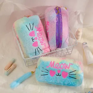 Macro view of plush pastel tie-dye makeup bag with sequined cat face and meow embroidery