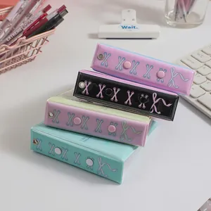 Detailed view of A8 mini binder photocard albums in four pastel colors with bow designs