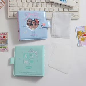 Close-up of PVC binder albums with heart cut-out window and secure snap button closure