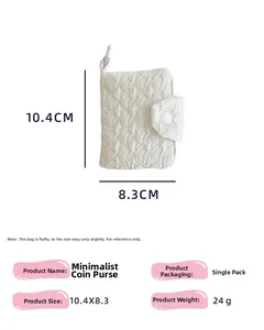 Detailed view of white quilted coin purse with snap closure and 10.4x8.3cm dimensions