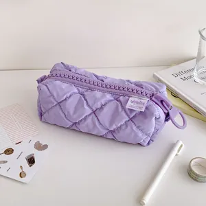 Detail of light purple quilted pencil case with large gear zipper and ring puller