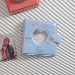 Detail of light blue A8 mini binder with heart cutout and pink bow ballet motif