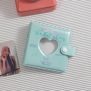 Detail view of mint green A8 binder with heart-shaped cutout for photo cards