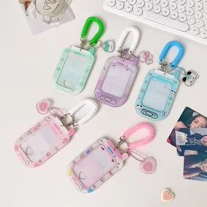 Flat lay of macaron-colored PVC card holders in retro phone shapes with charms