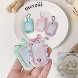 Detail of cute phone-shaped photocard holder with pastel colors and metal bead chain