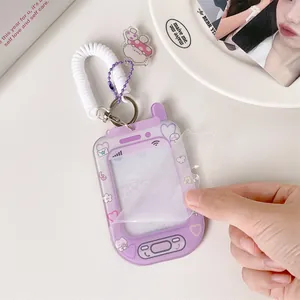 Purple phone-shaped acrylic card holder with spring wristlet and cat charm accessory