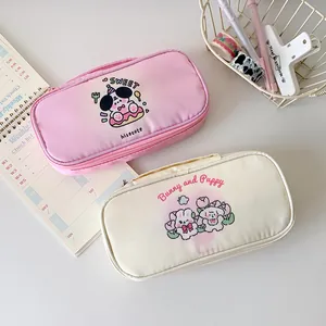 Detail view of large capacity cartoon puppy pencil bags with double zipper compartments