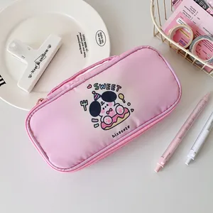 Detail of pink canvas pencil case with cartoon panda, zipper closure and side handle