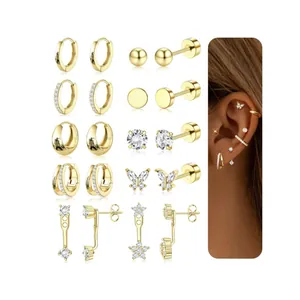 Golden plated brass earring set featuring hoops, studs, and cubic zirconia dangles