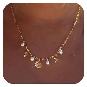 Golden starfish seashell and pearl charm necklace for beach summer fashion style