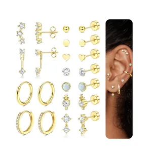 Macro detail of 16-piece gold-plated earring set with zircon and opal-style studs