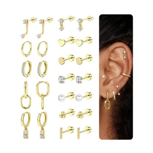 Detailed close-up of 12 pairs of gold-plated earrings including hoops, studs and pearls