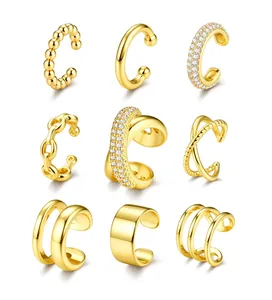 Detail set of nine gold plated ear cuffs featuring zircon stones and textured metal designs