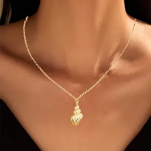 Golden brass shell pendant necklace for women with elegant spiral texture on O-chain
