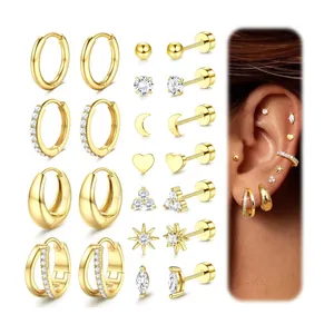 Macro shot of 11 pairs of gold-plated brass earrings set with diverse geometric shapes