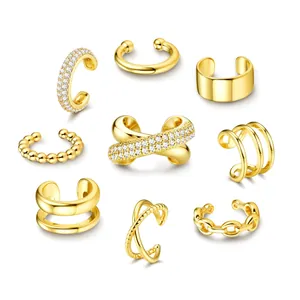 Set of 9 gold-plated brass ear cuffs featuring minimalist and cubic zirconia designs