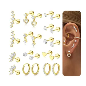 Gold plated brass earring set with zircon hearts and studs displayed with on-ear view
