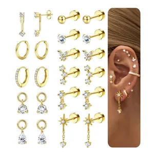 Gold plated brass earring set with cubic zirconia featuring stud and hoop styles