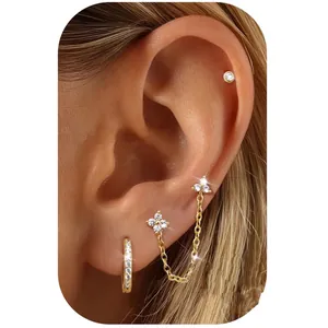 Three-piece gold plated brass earring set with crystal studs and chain link cuff for women