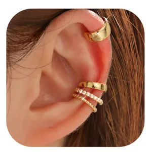 Detail showing a 4-piece set of gold-plated ear cuffs with braided and crystal pavé textures