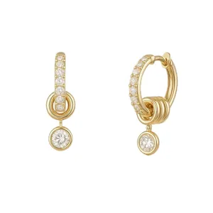 Detail of gold-plated hoop earrings with micro-paved zircons and round-cut drop pendants