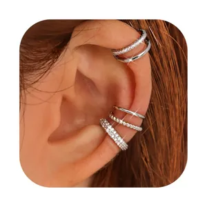 Detailed view of silver non-piercing ear cuffs with micro zircon stones on model