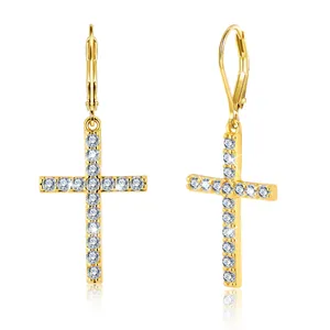 Detail shot of gold-plated lever-back earrings with S925 hallmark and sparkling cross charms