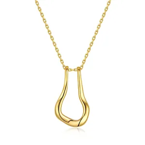 Close-up of gold plated brass necklace featuring a fluid liquid metal pendant on a fine chain
