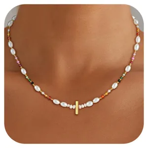 Detail of bohemian pearl and multi-color glass bead necklace with gold rectangular pendant