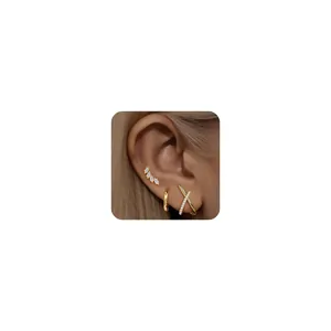 Chic gold stud earrings set featuring marquise stones and diamond-set crisscross X design