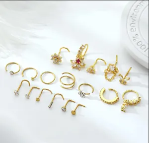 Detailed set of 18k gold plated brass nose rings and studs with zircon butterfly designs
