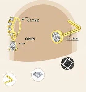 Detailed view of 20G gold-plated nose ring and L-shaped stud with cubic zirconia stones