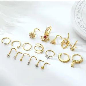18-piece gold brass nose rings set with sparkling cubic zirconia in diverse shapes