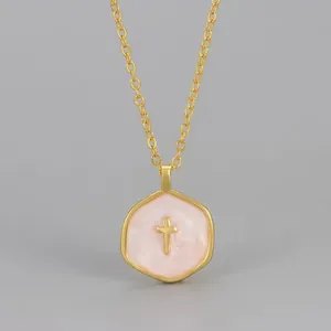 Cross pendant necklace with pink marble effect and 14k gold plated hexagonal frame
