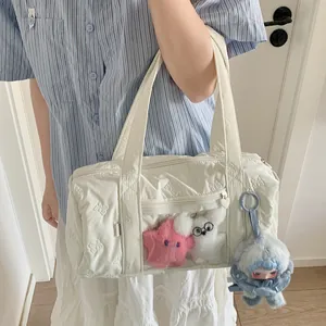 White quilted Boston bag with bow texture, transparent display window and plush charms