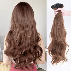 Detail view of 22-inch deep brown clip-in hair extensions with large wavy curls and texture