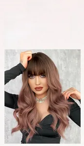 Detail of pinkish brown wavy wig with natural bangs and brown gradient roots