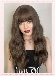 Detail of 22-inch long wavy dark brown wig with airy bangs on a model